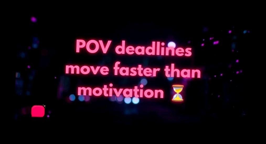 A pink neon POV caption graphic about deadlines and motivation displayed over a dark blurred city bokeh background